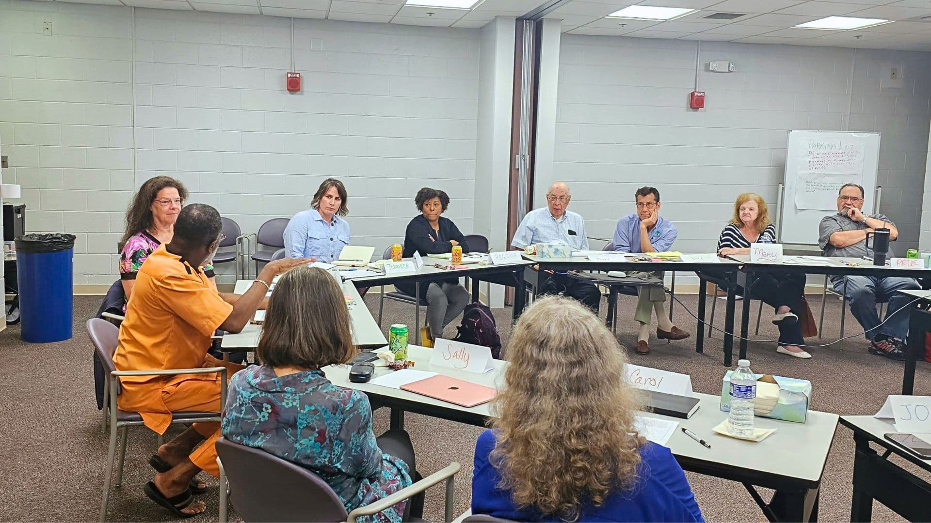 Nonprofit leaders and community organizers planning together in an outdoor setting